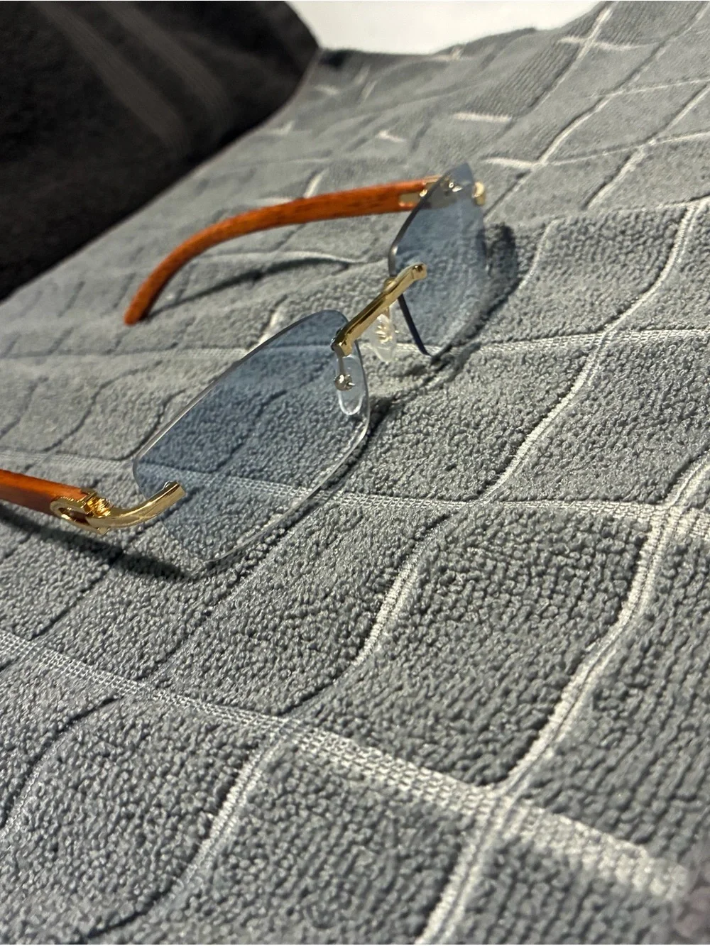 Rimless Blue Lens Sunglasses with Wood Arms and Gold Bridge